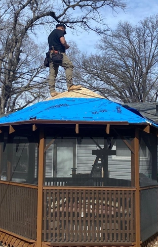 Johnson Restoration Worker on Shake Roof