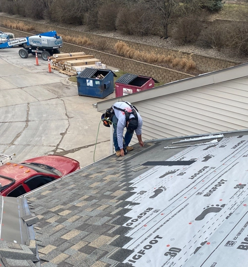 Johnson Restoration Worker Installing Fascia