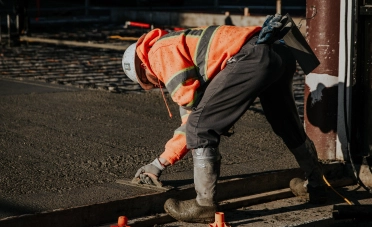 Construction Worker Finishing Concrete